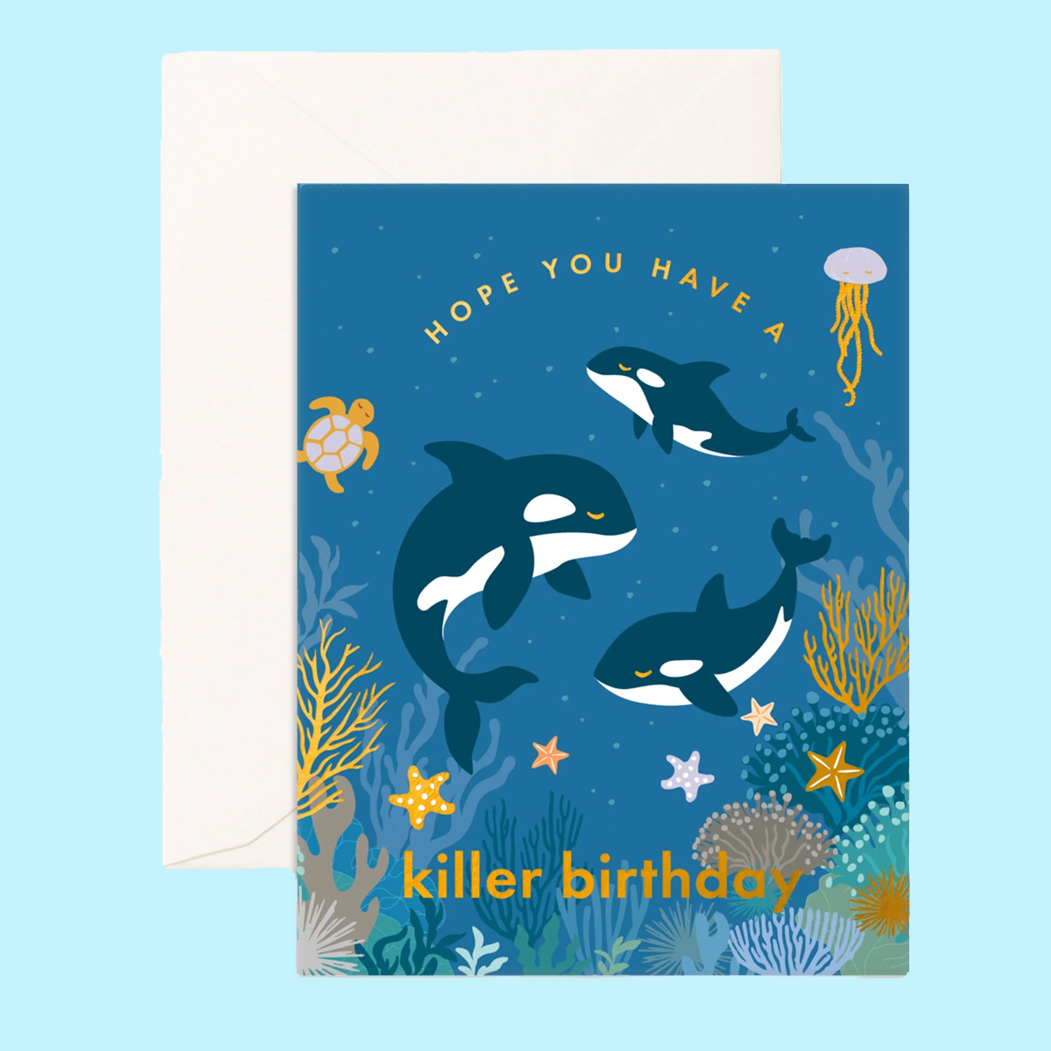 On a blue background is a blue card with orca whales and gold text that reads, "Hope You Have A Killer Birthday". 