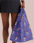 A purple nylon tote bag with a Kuromi pattern. 