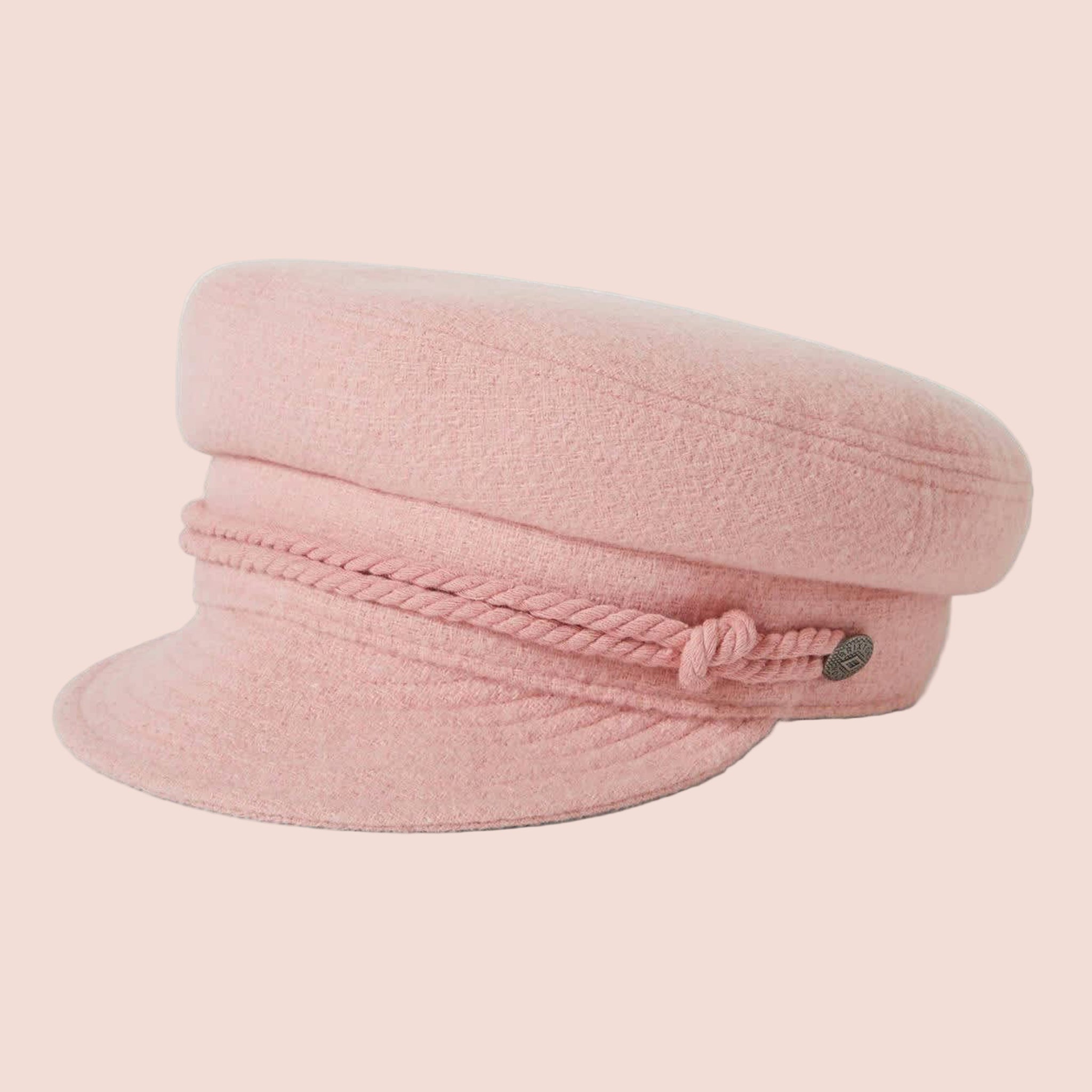 A soft pink boucle cap hat with rope detailing. 