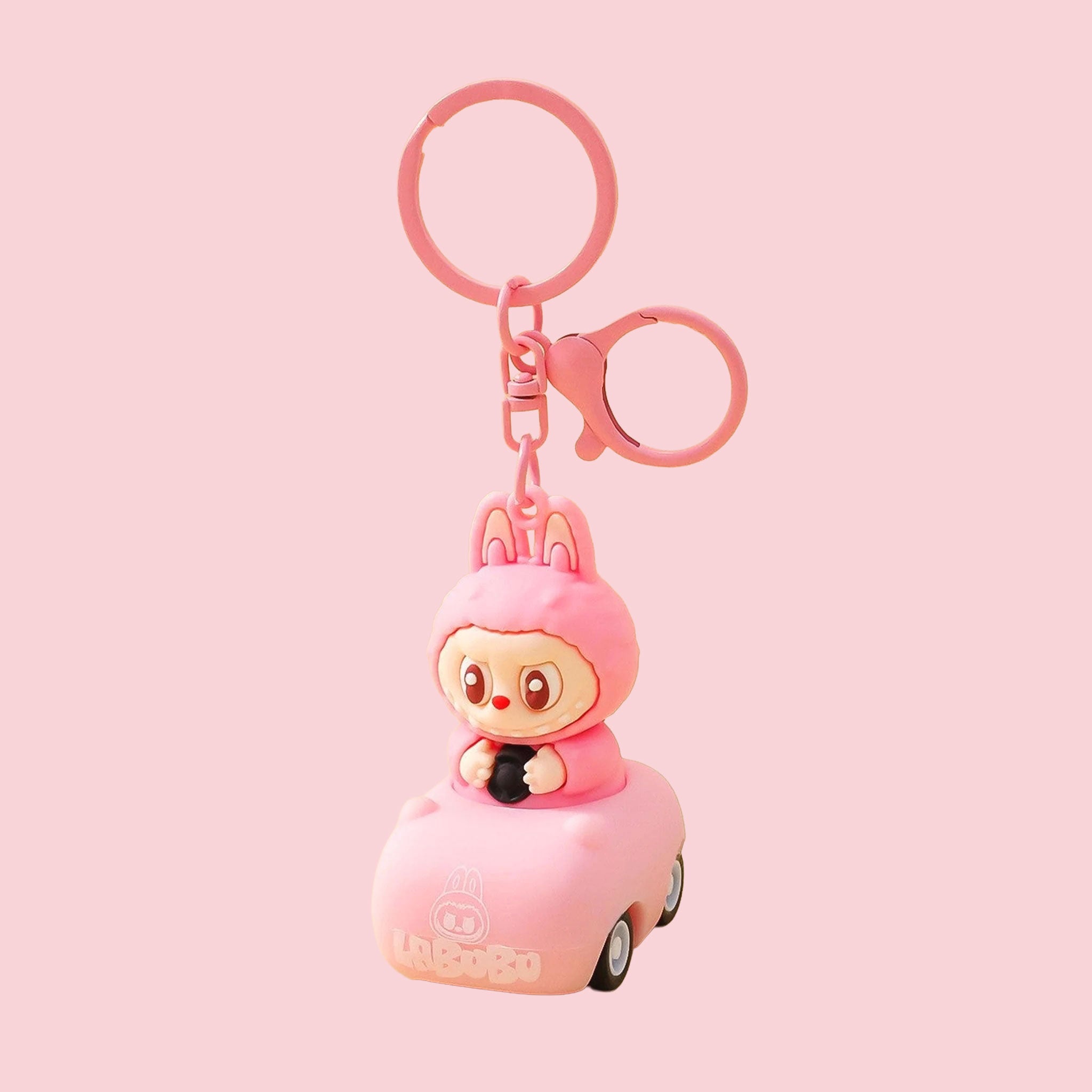 A pink labubu shaped keychain.