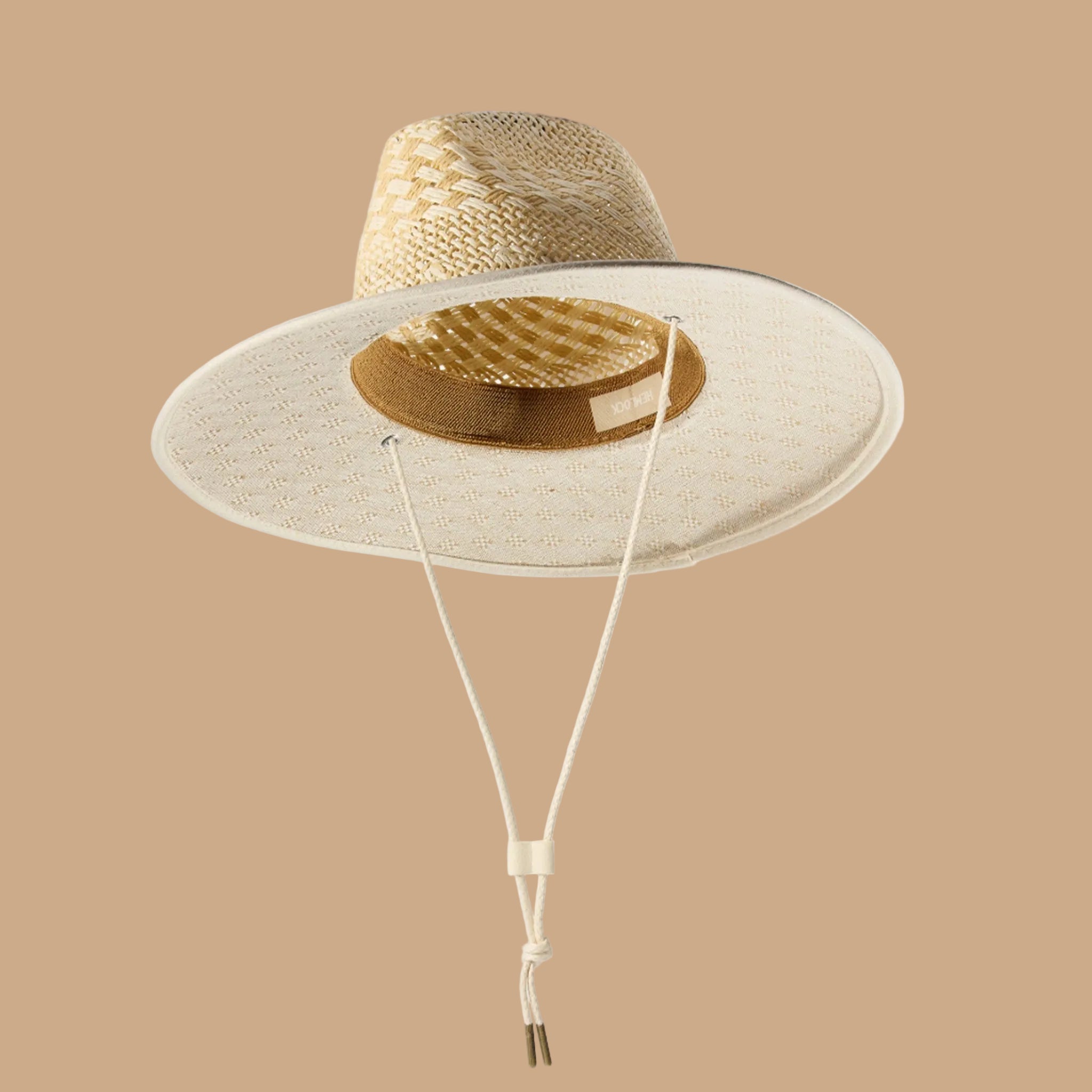 A light off white/sand colored straw sun hat. 