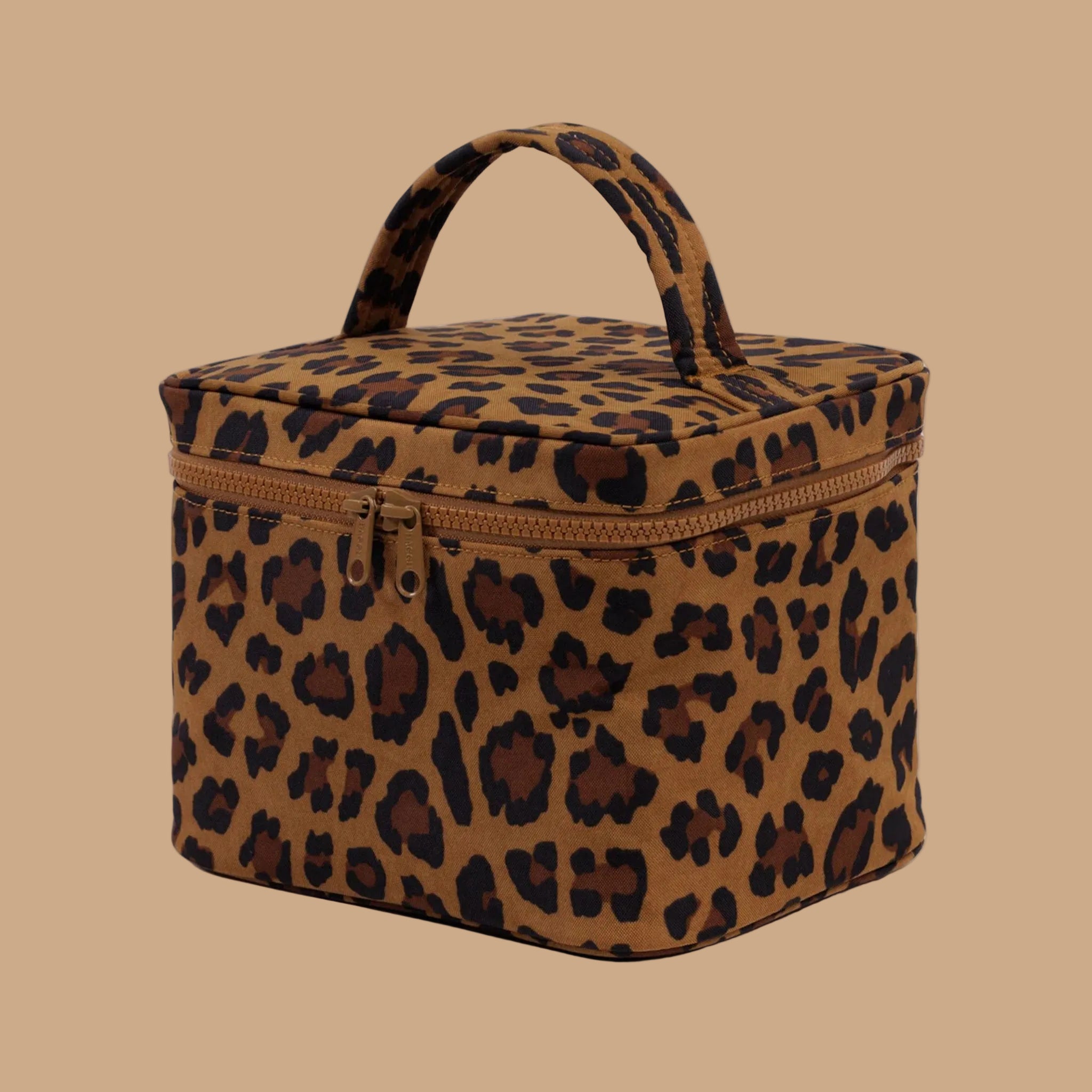 A leopard print cosmetic case with a zipper and handle. 