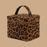 A leopard print cosmetic case with a zipper and handle.