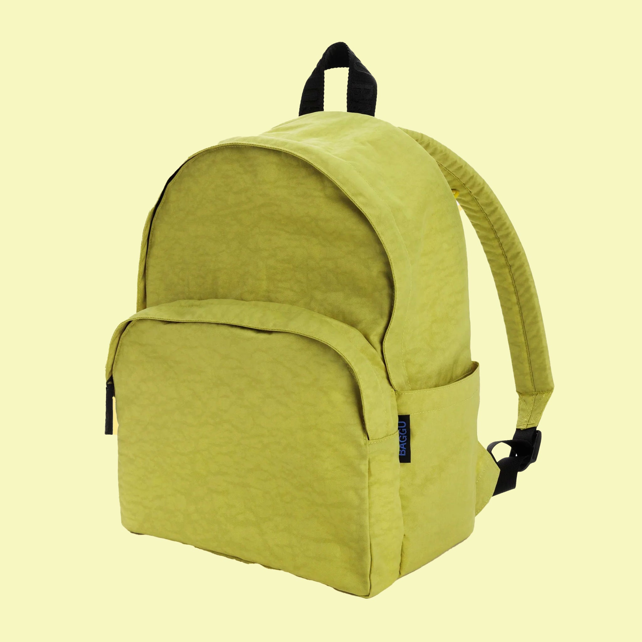 A lemongrass green nylon backpack with front pockets and black details.