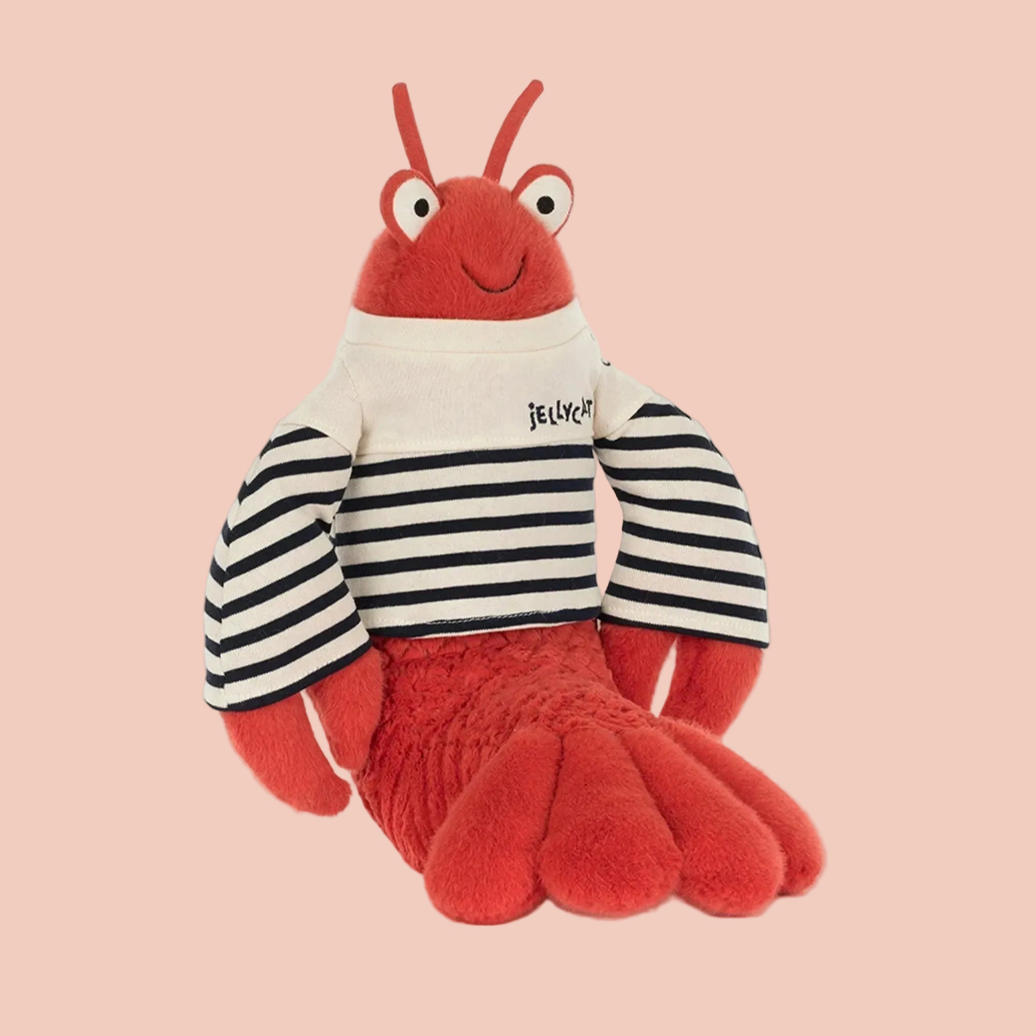 Plush toy lobster with striped shirt on a white background