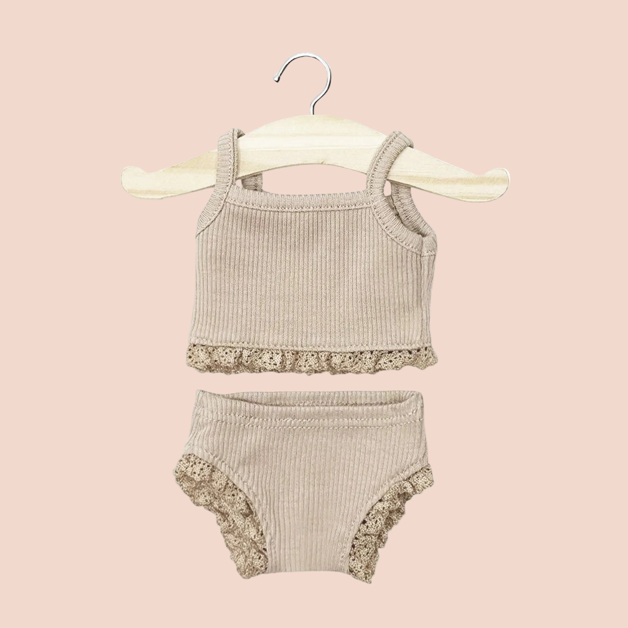 A neutral tan doll clothing set with a lace trim. 