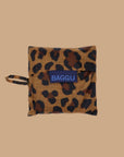 A small nylon tote bag in a leopard print that folds up into a small pouch. 