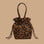 A brown and black drawstring handbag. 