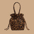 A brown and black drawstring handbag. 