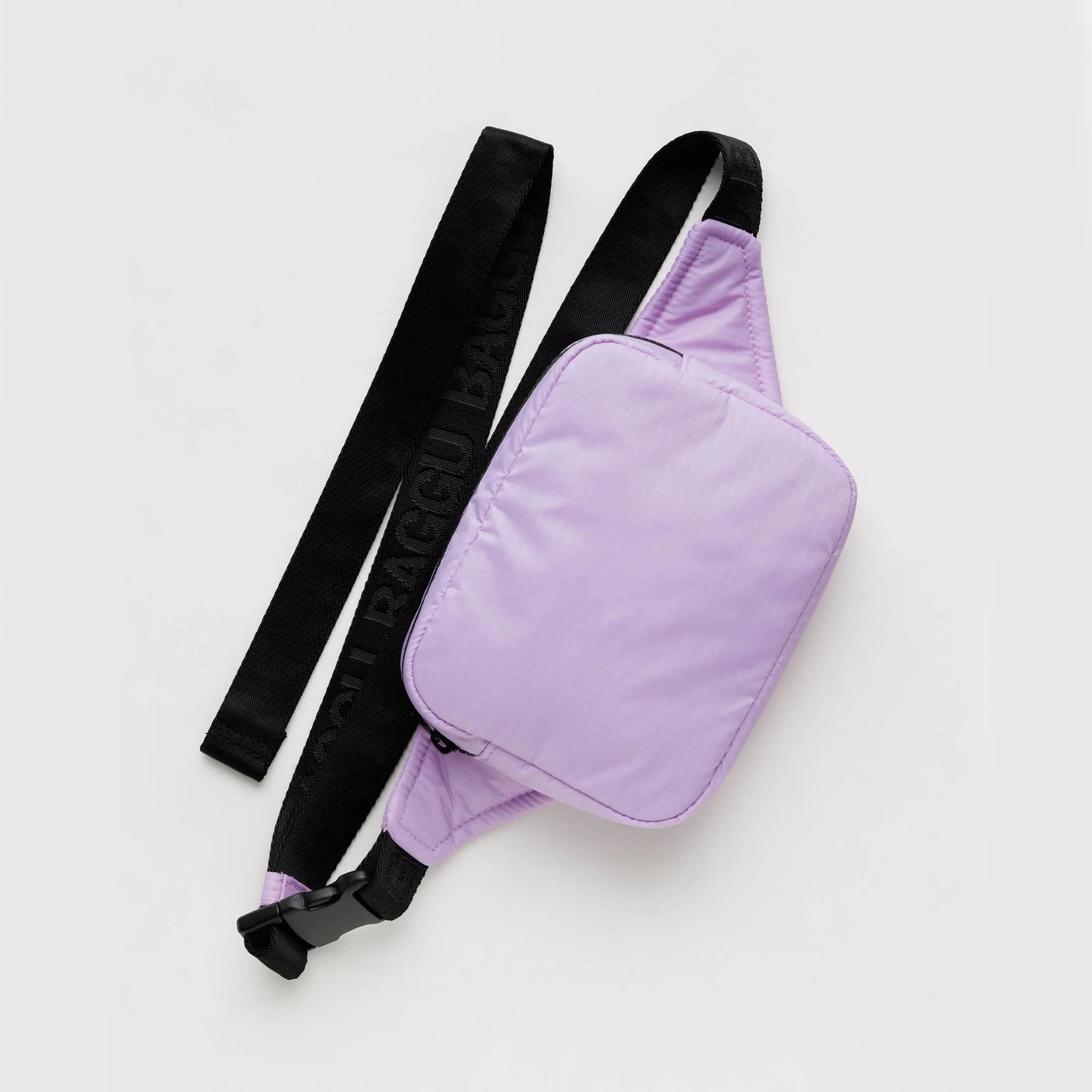 On a white background is a lilac puffy fanny pack with a black strap. 