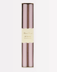 On a white background is a pair of lilac colored taper candles with a ribbed detail. 