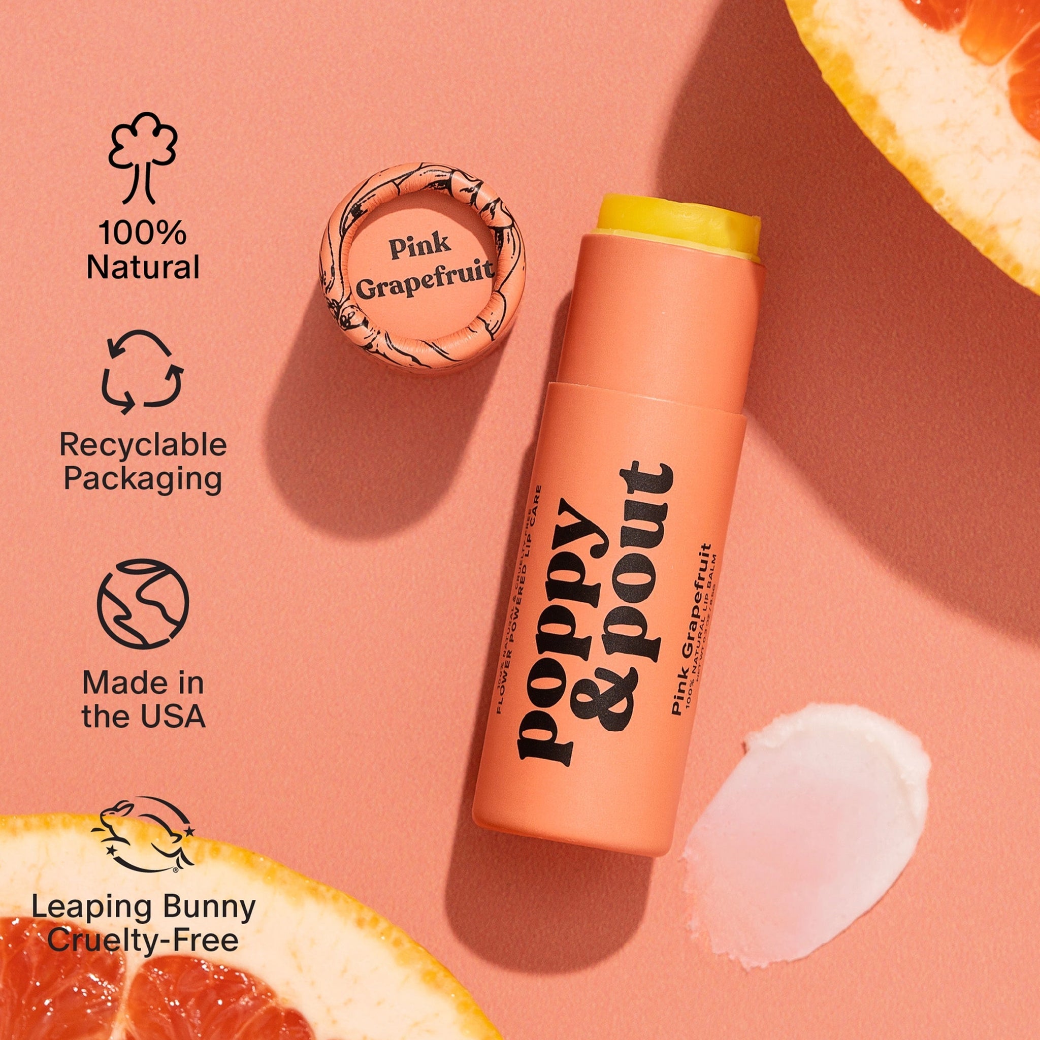 A box filled with a lip scrub and apricot colored lip balm tube. 