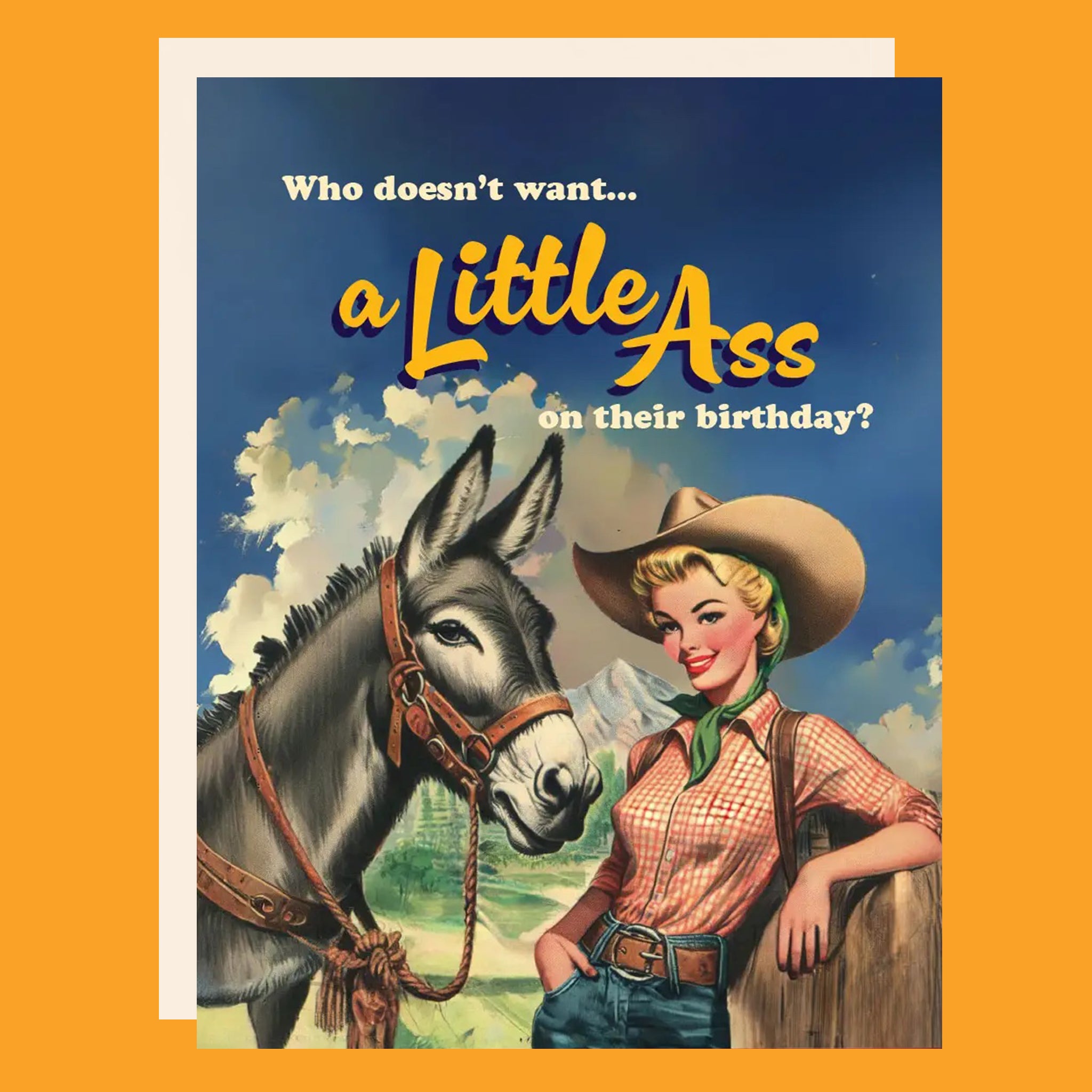 Greeting card with a donkey and cowgirl. The card reads "Who doesn't want... a little ass on their birthday?".