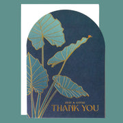 Greeting card with blue and gold leaf design and 'Just a little thank you' text on a teal background