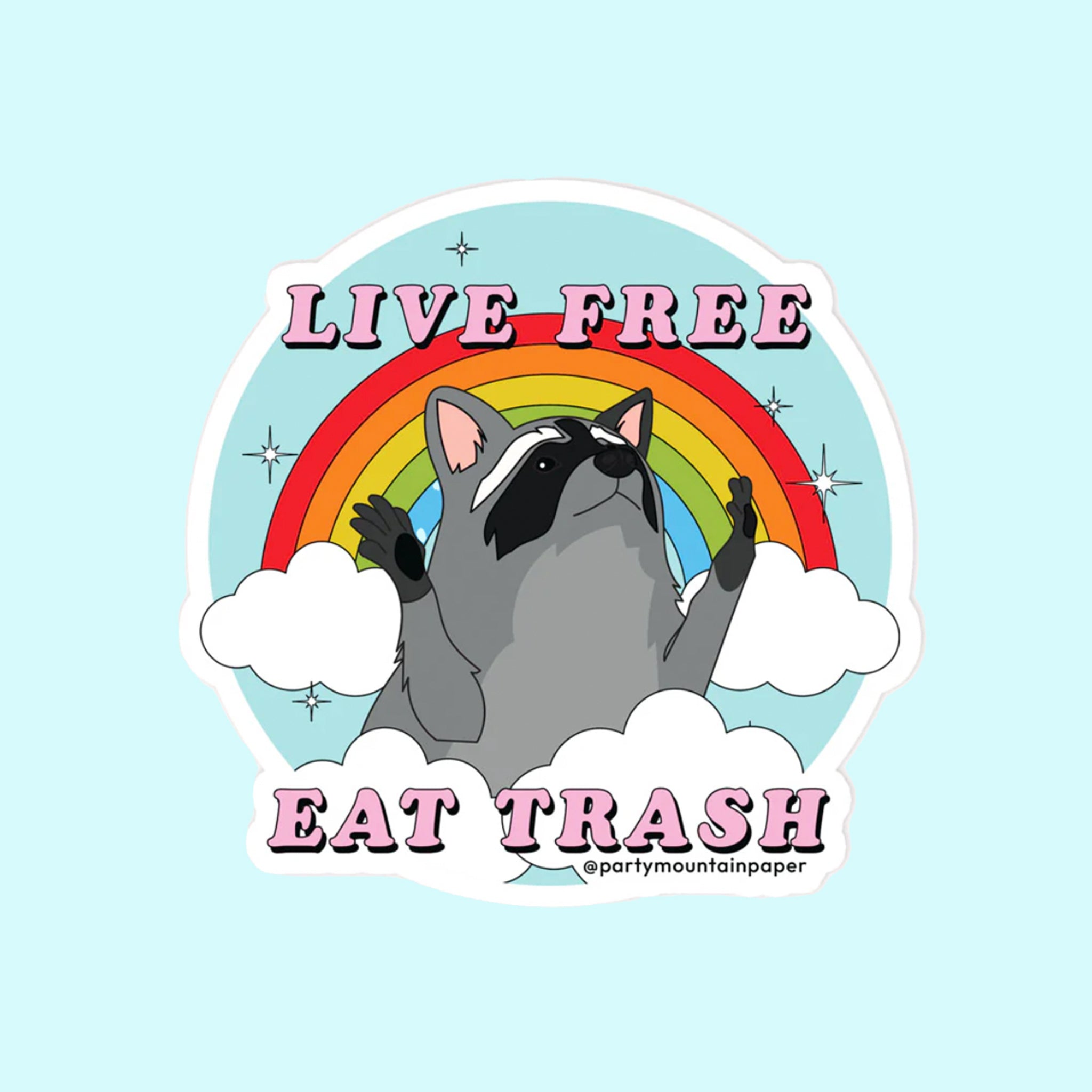 On a blue background is a blue sticker with a graphic of a raccoon in front of a colorful rainbow with text reading, "Live Free Eat Trash". 