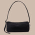 A black loaf shaped nylon shoulder bag. 