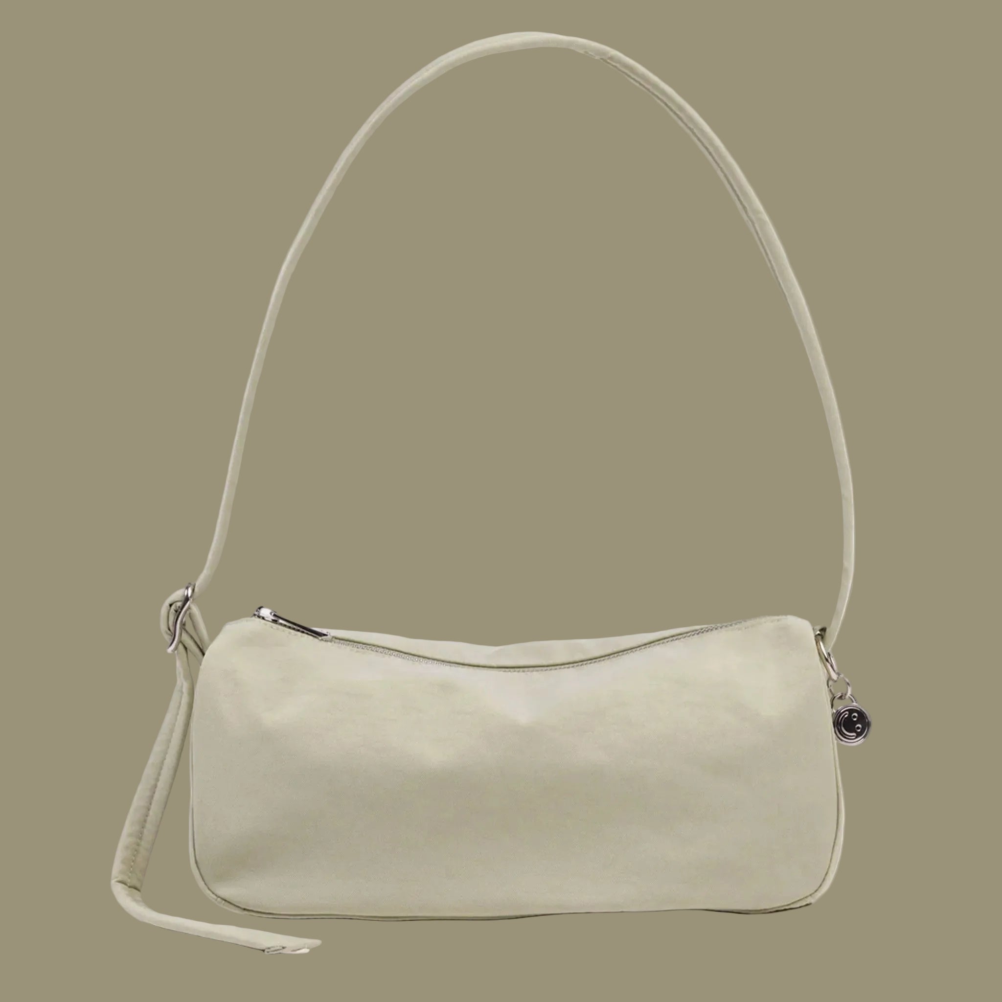 A pale green loaf shaped shoulder bag. 