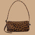 A brown and black leopard print loaf shaped shoulder bag. 