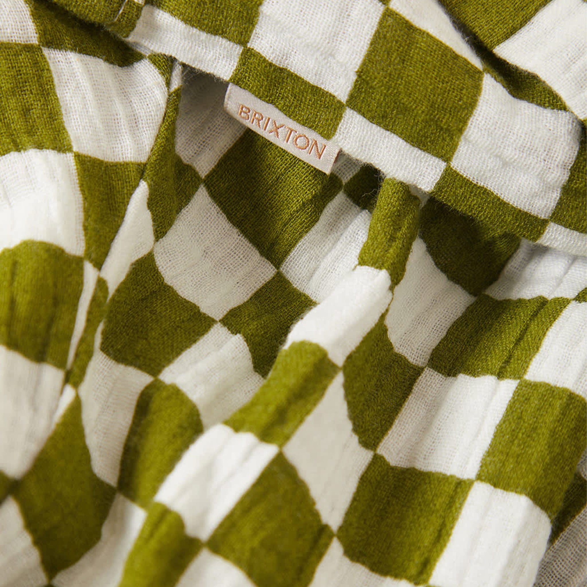 Green and white checkered fabric with Brixton logo
