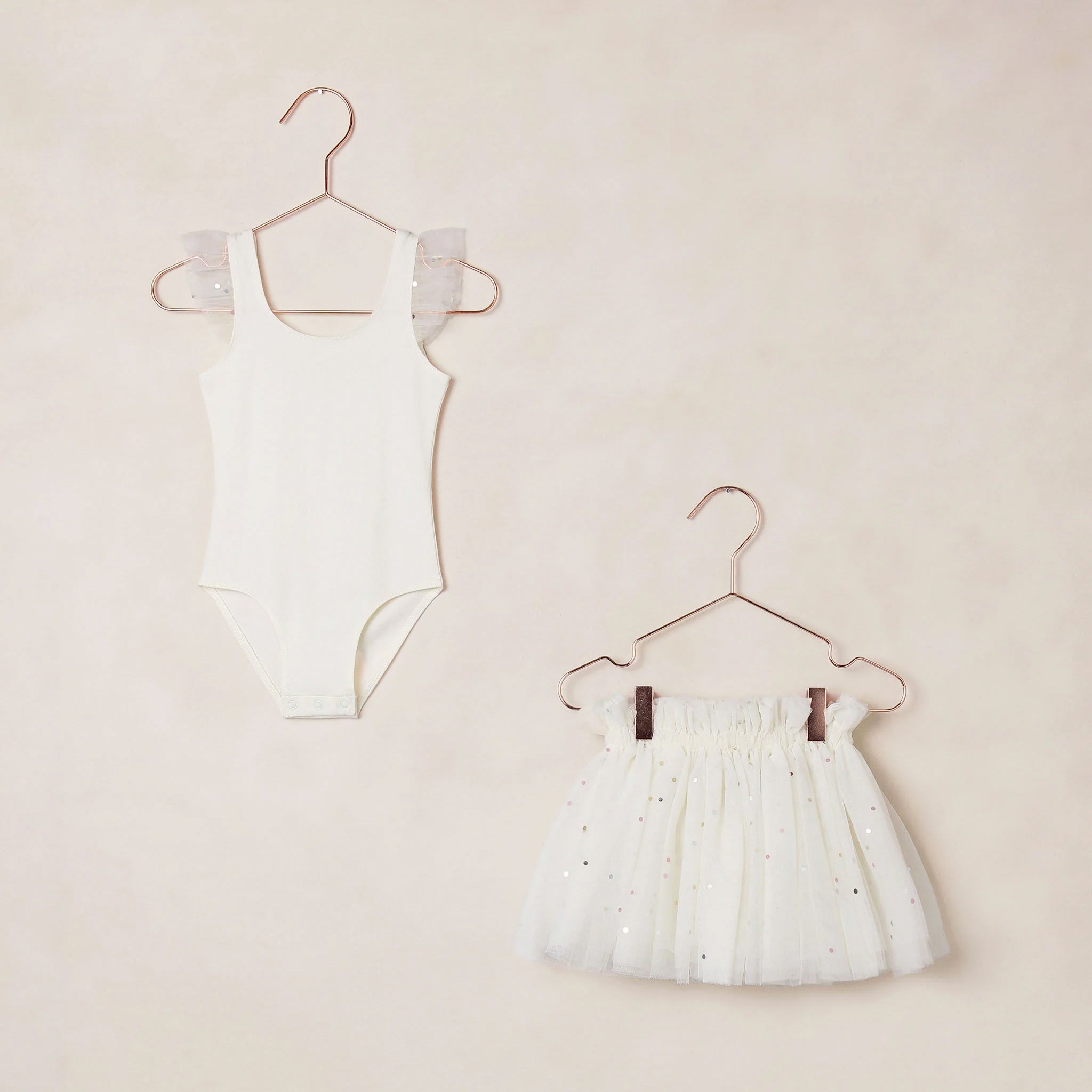 An ivory sparkle tutu and leotard tank top set. 