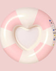 A pink and white striped pool float but the center is in the shape of a heart with a mesh backing. 