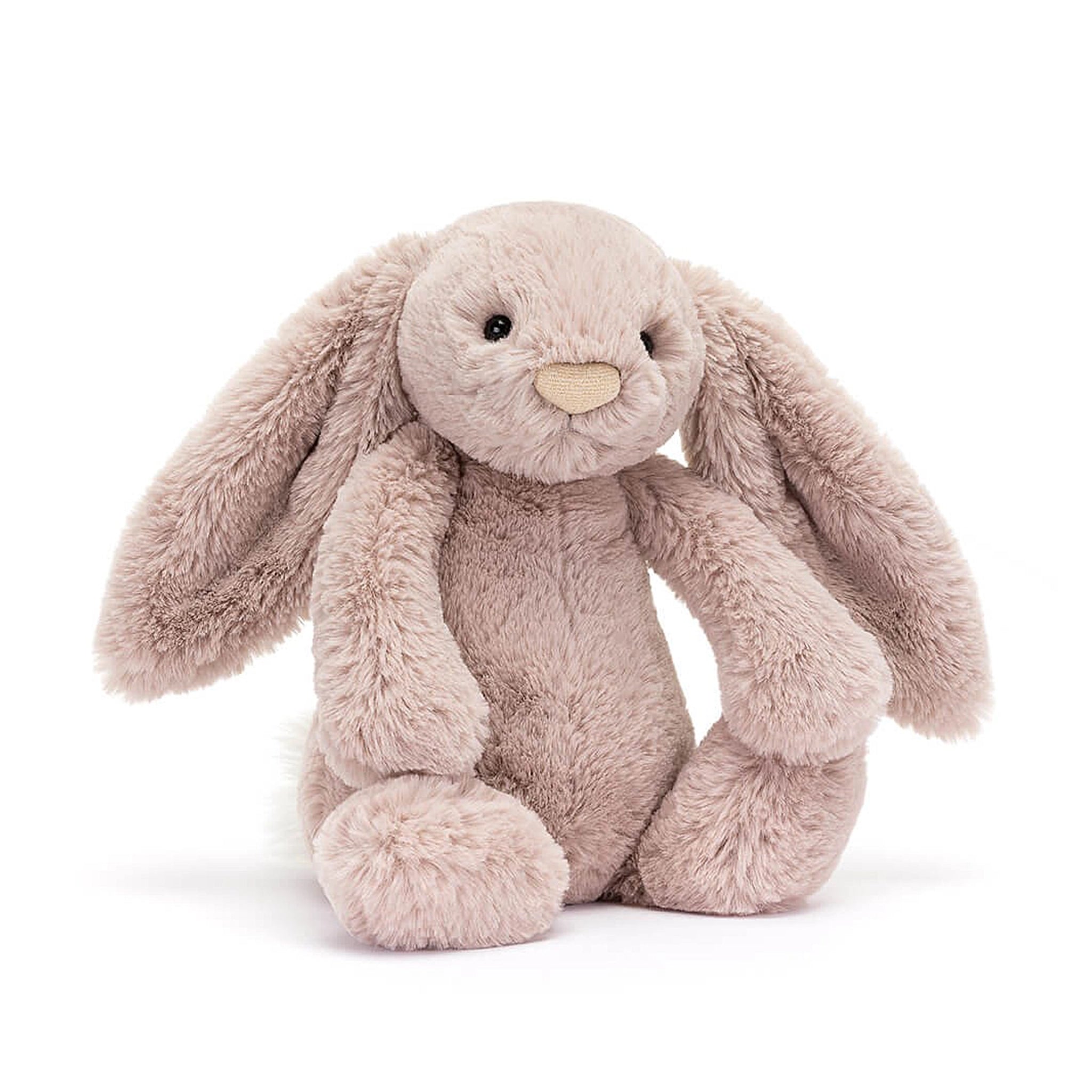 On a white background is a light pink stuffed animal bunny with long floppy ears and super soft faux fur. 