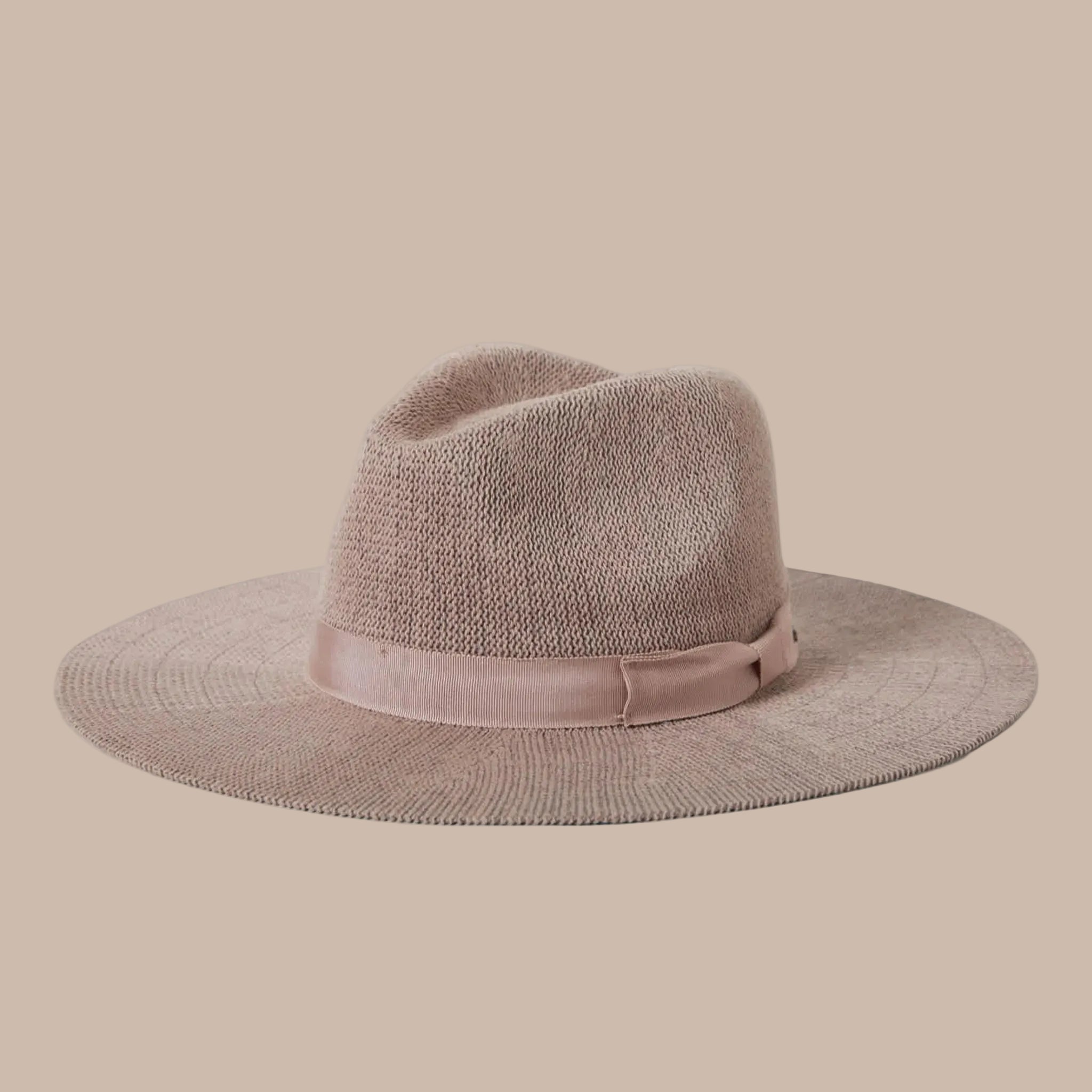 A neutral mauvy tan packable straw sun hat. 