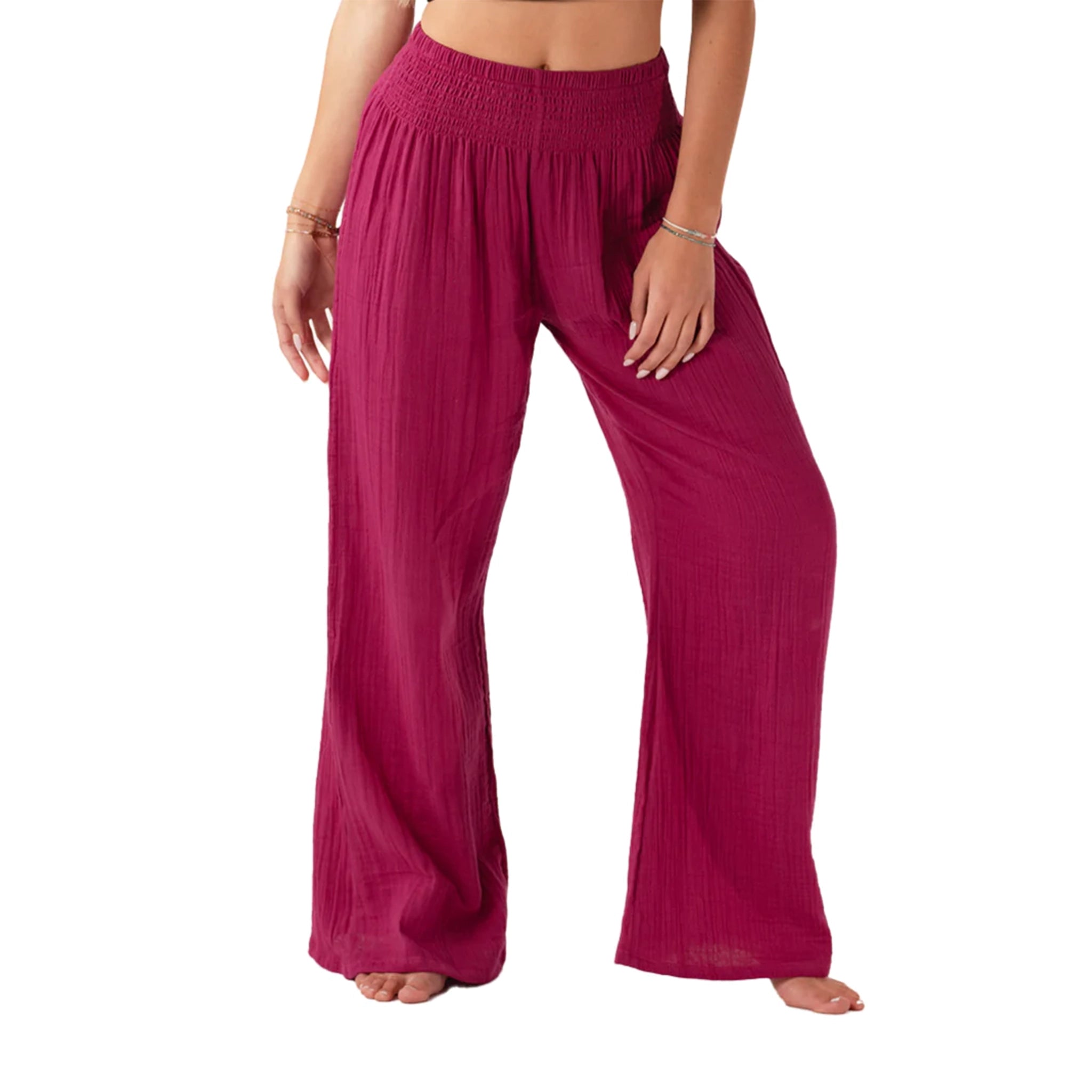 On a white background is a model wearing magenta wide leg cotton pants with an elastic drawstring.  Edit alt text