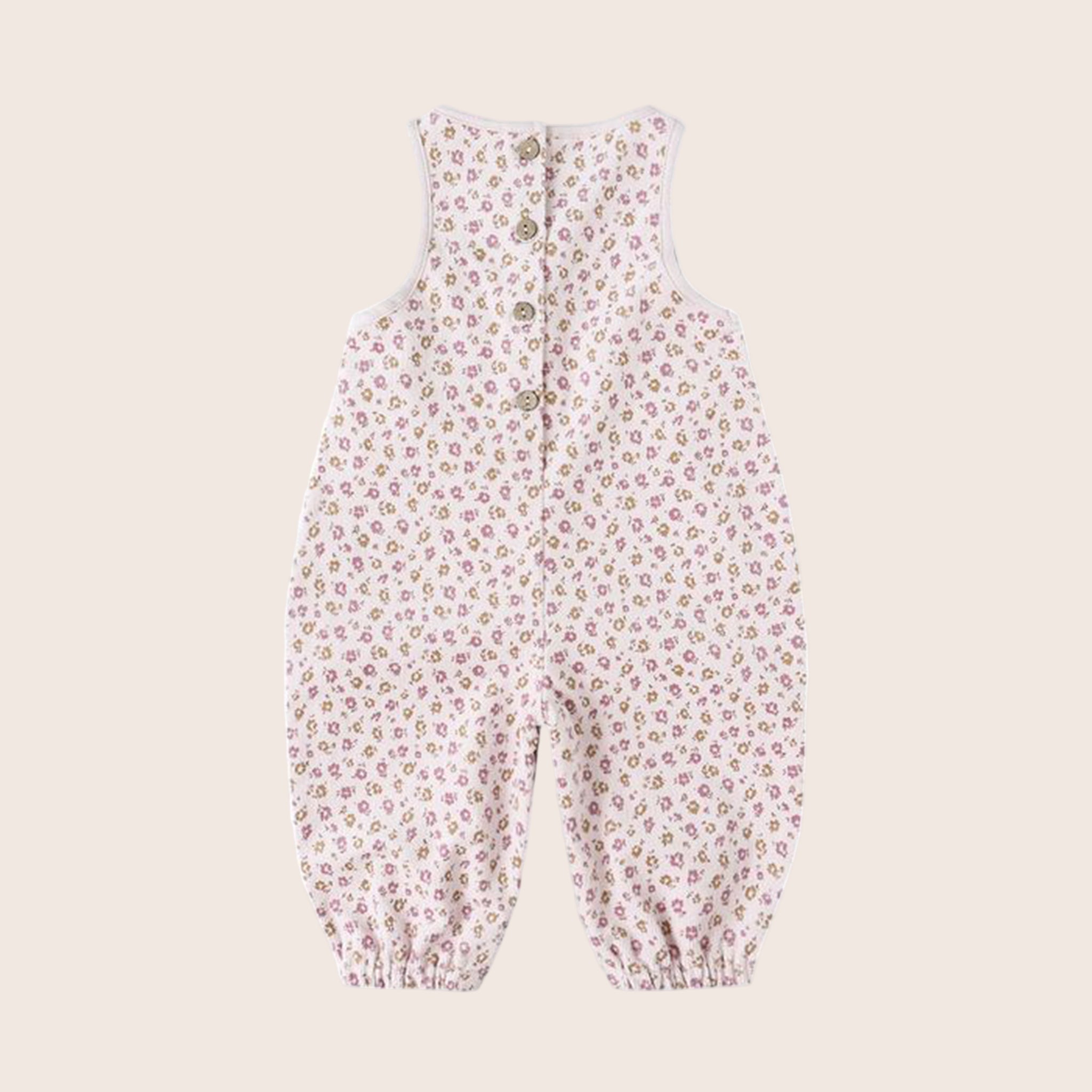 A pair of light pink floral overalls for kids. 