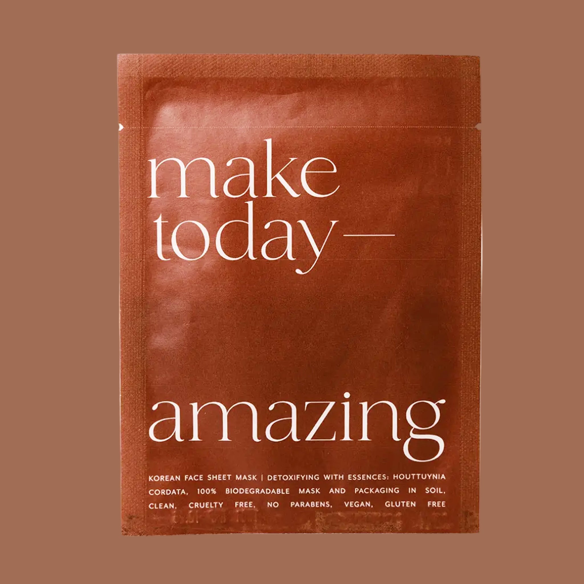An orange, brown packaging of a sheet mask that reads, "make today - amazing Korean Face Sheet Mask". 