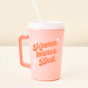 On a tan background is a pink travel mug with a handle and a white lid and straw and text on the front that reads, "Mama knows Best". 