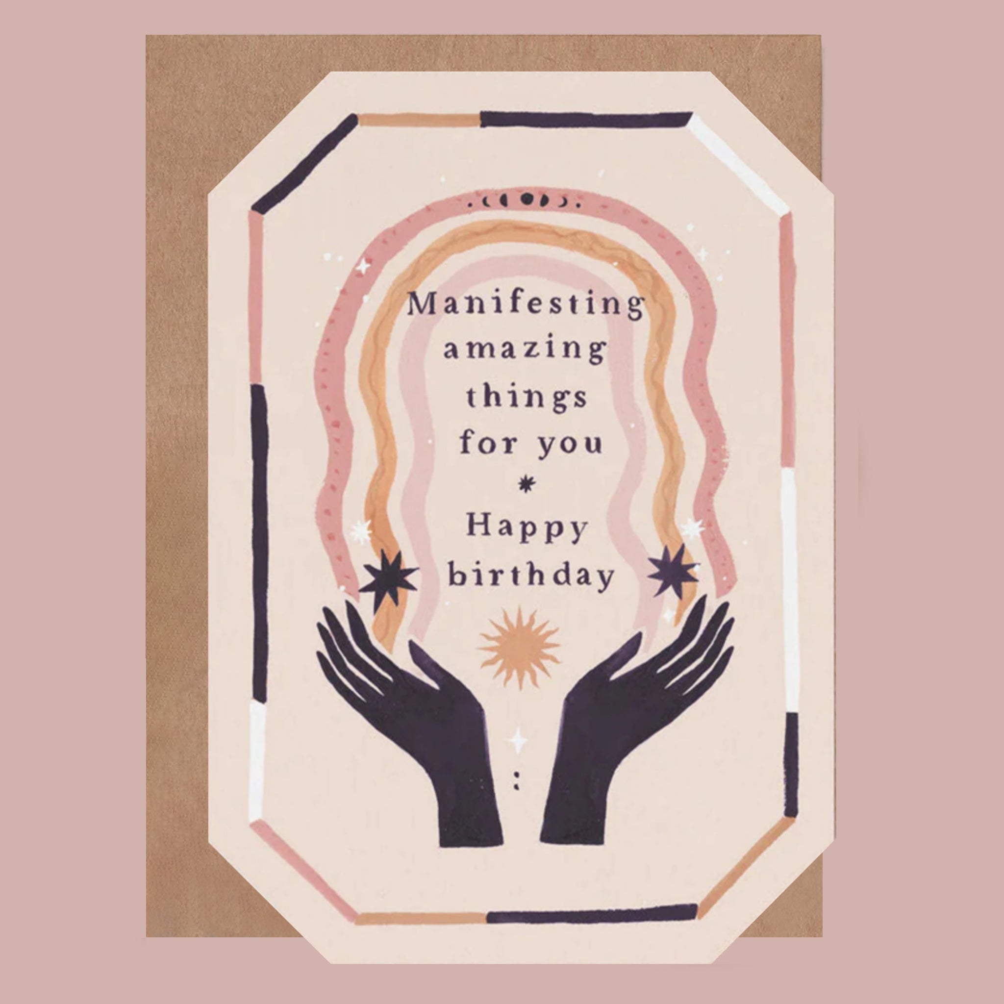 Greeting card with hands holding a sun and text that reads 'manifesting amazing things for you. happy birthday' on a pink background