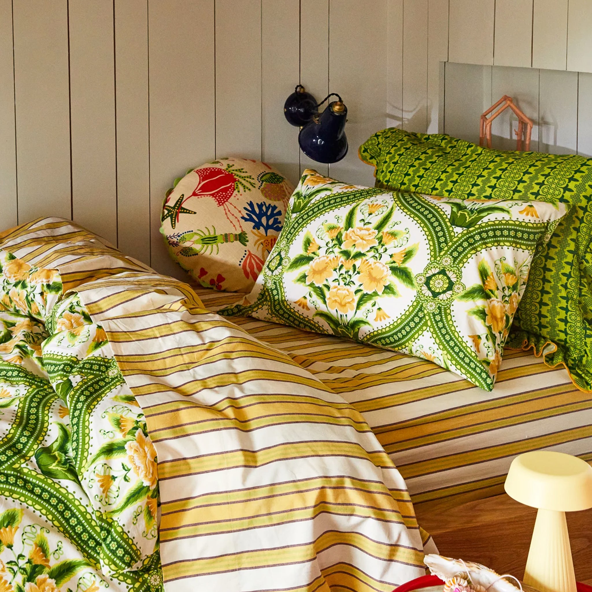 a green and yellow floral pillowcase. 