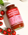 A glass jar of marinara with text that reads, 'ciao pappy Marinara Classico'. 