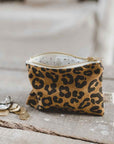 A brown and black leopard print canvas coin purse. 