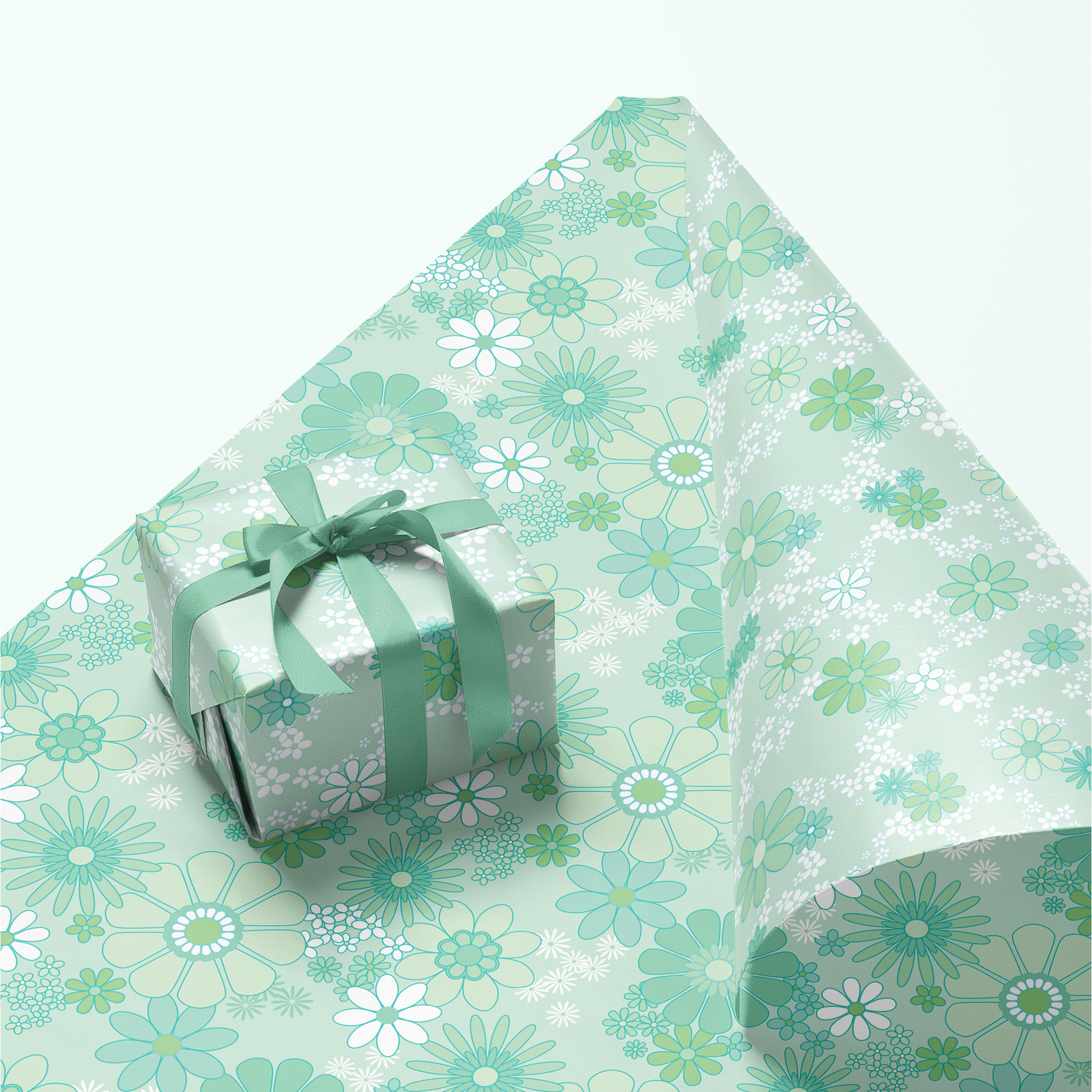 On a teal background is a gift box wrapped in a mint floral print wrapping paper with a velvet bow, not included with purchase.