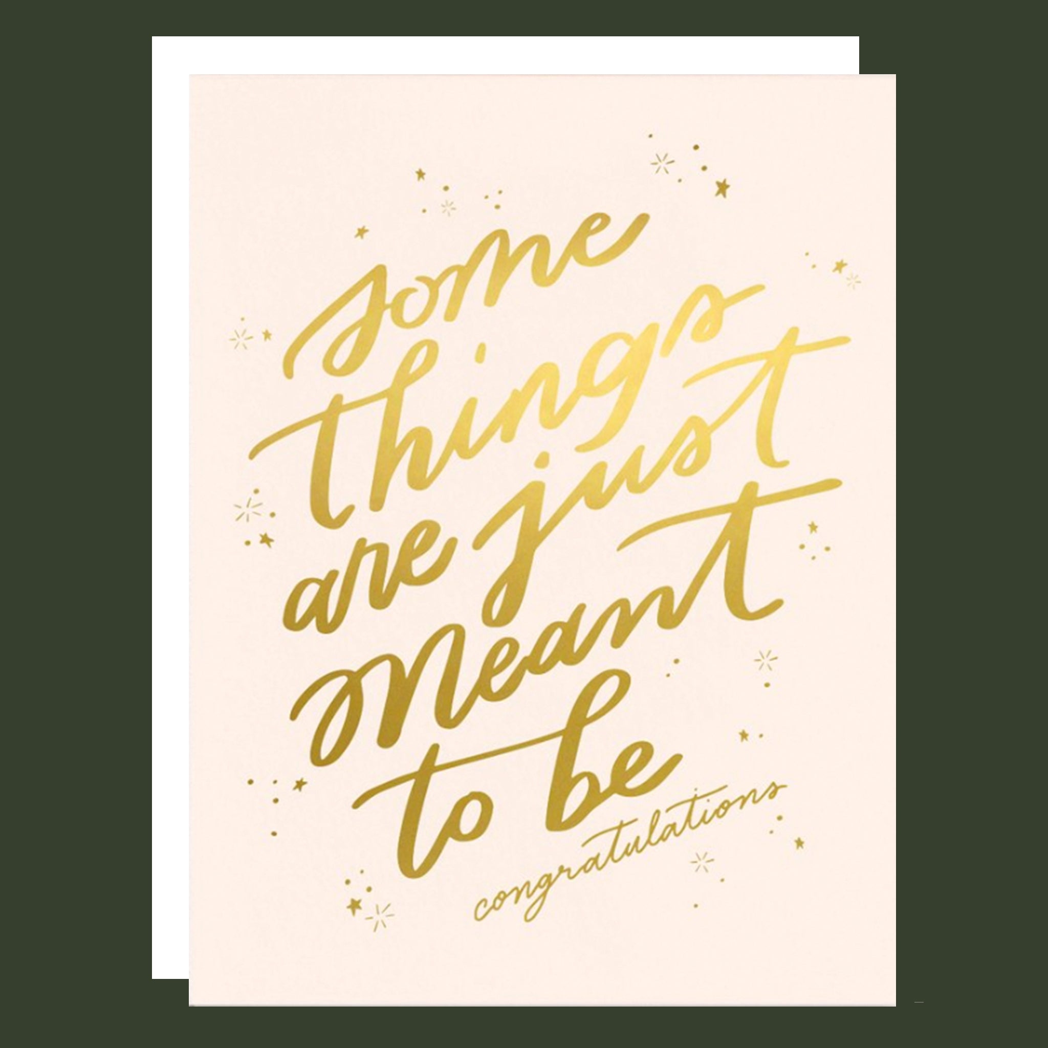 A cream card with gold foiled words that read, "Some things are just meant to be. Congratulations" alongside a matching white envelope.