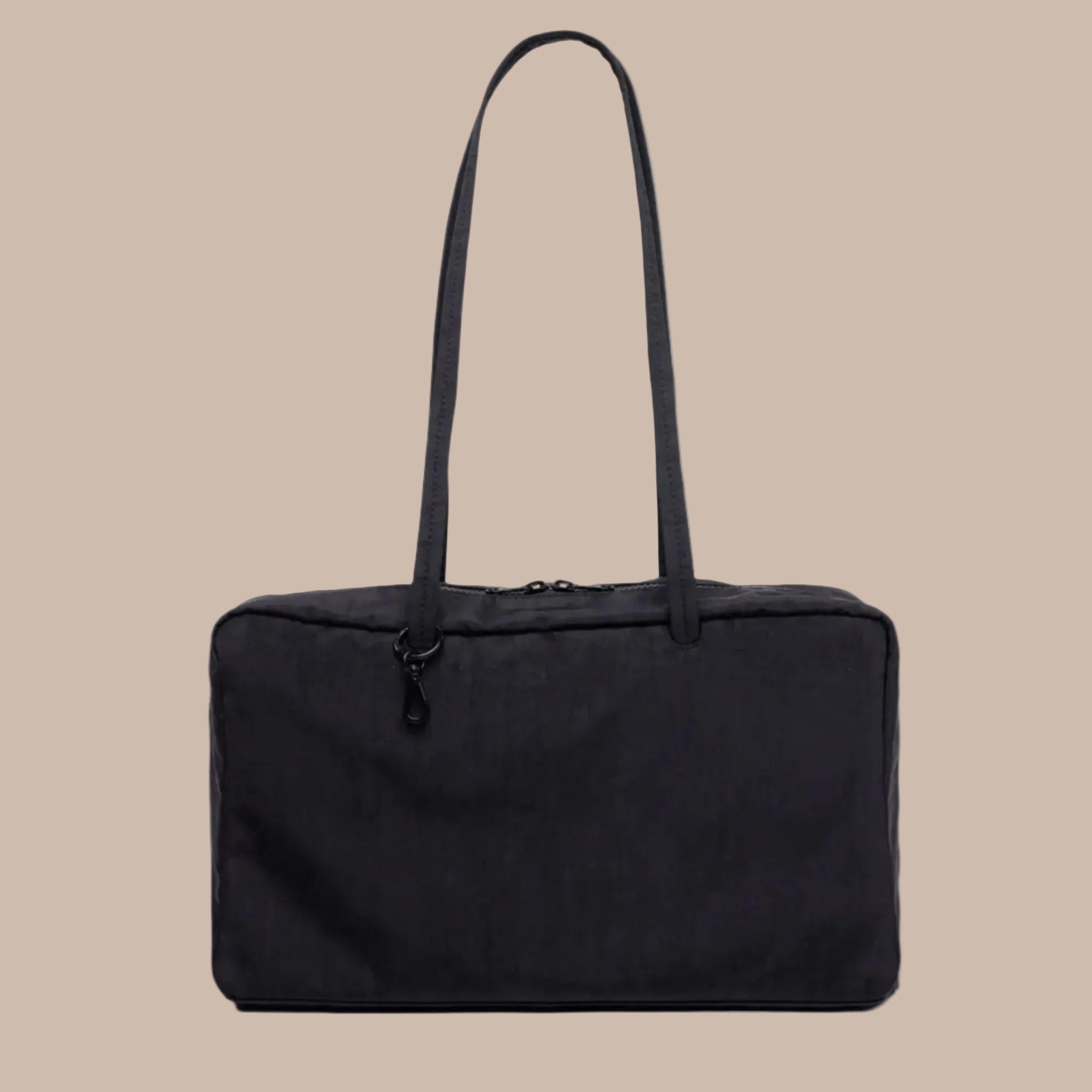 A black medium shoulder bag in a nylon material. 
