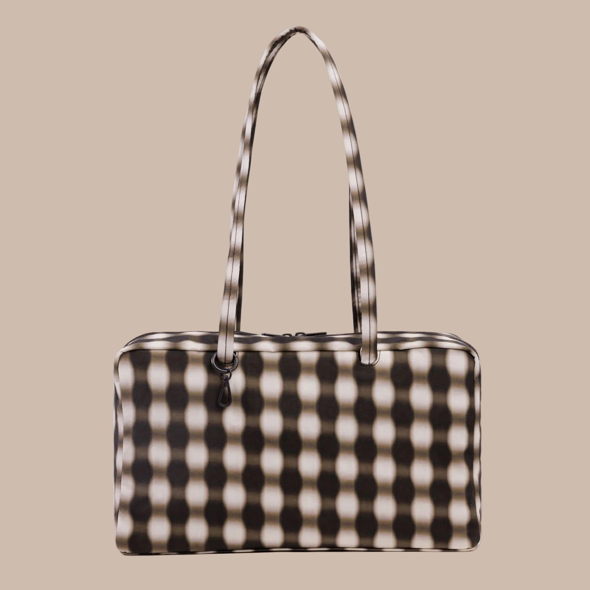 An ivory and brown blurred gingham print rectangle shaped nylon shoulder bag. 