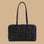 A black rectangular tote bag with a subtle floral pattern, featuring dual top handles and a top zipper closure