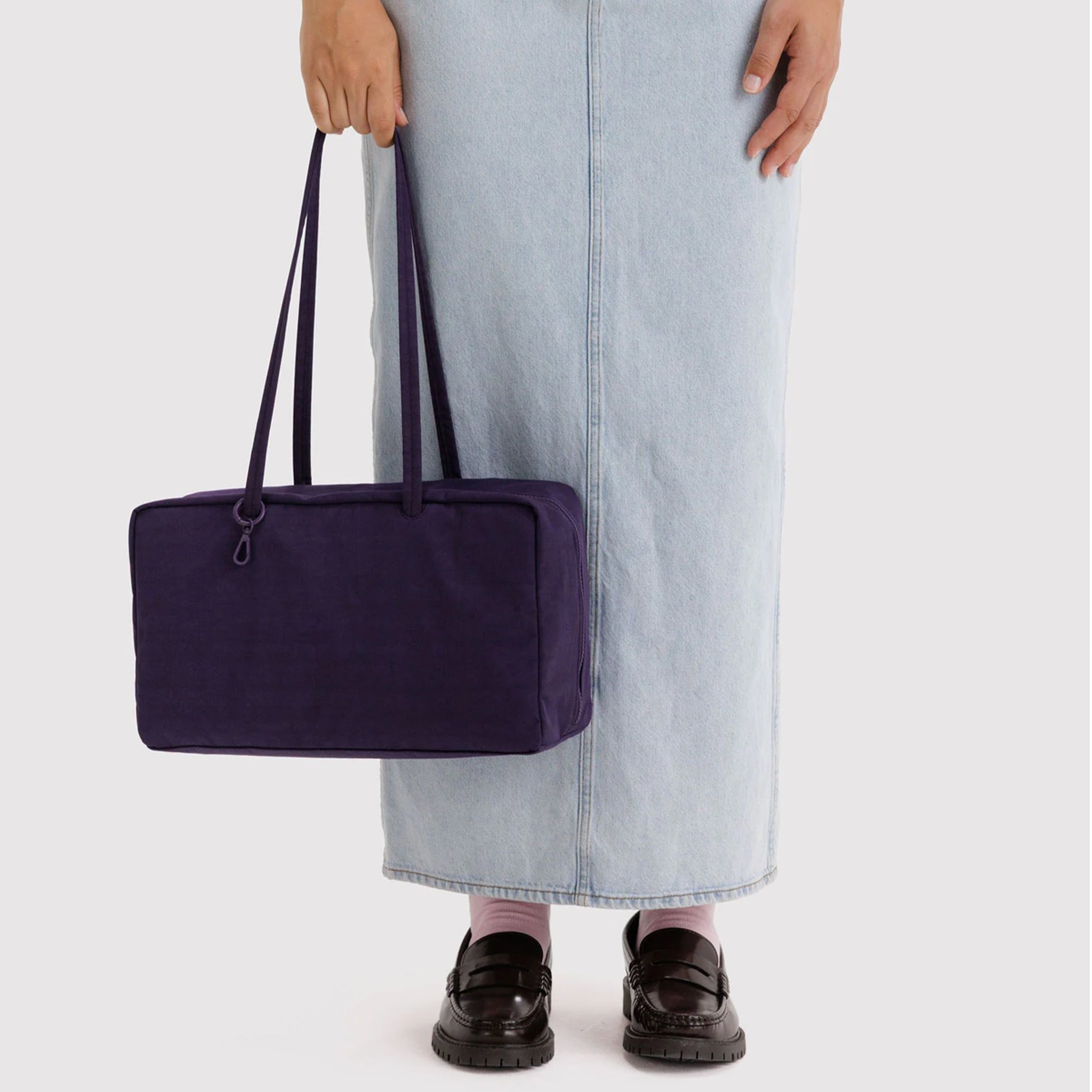 A dark purple rectangle shoulder bag. 