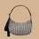A black and cream gingham print shoulder bag.