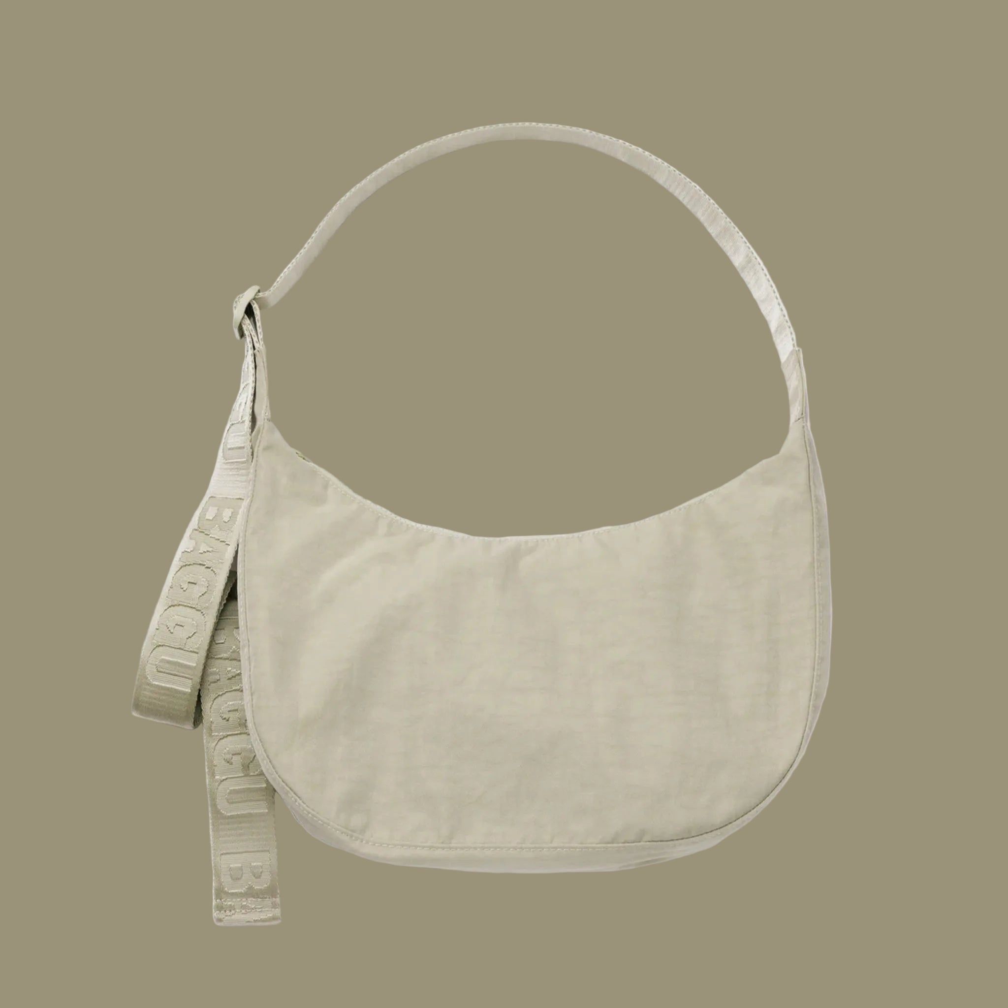 A super pale green nylon crescent shaped shoulder bag. 