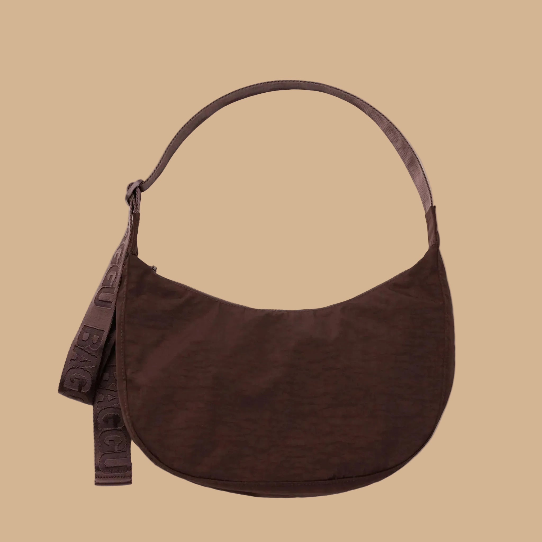 A coffee brown nylon shoulder bag. 