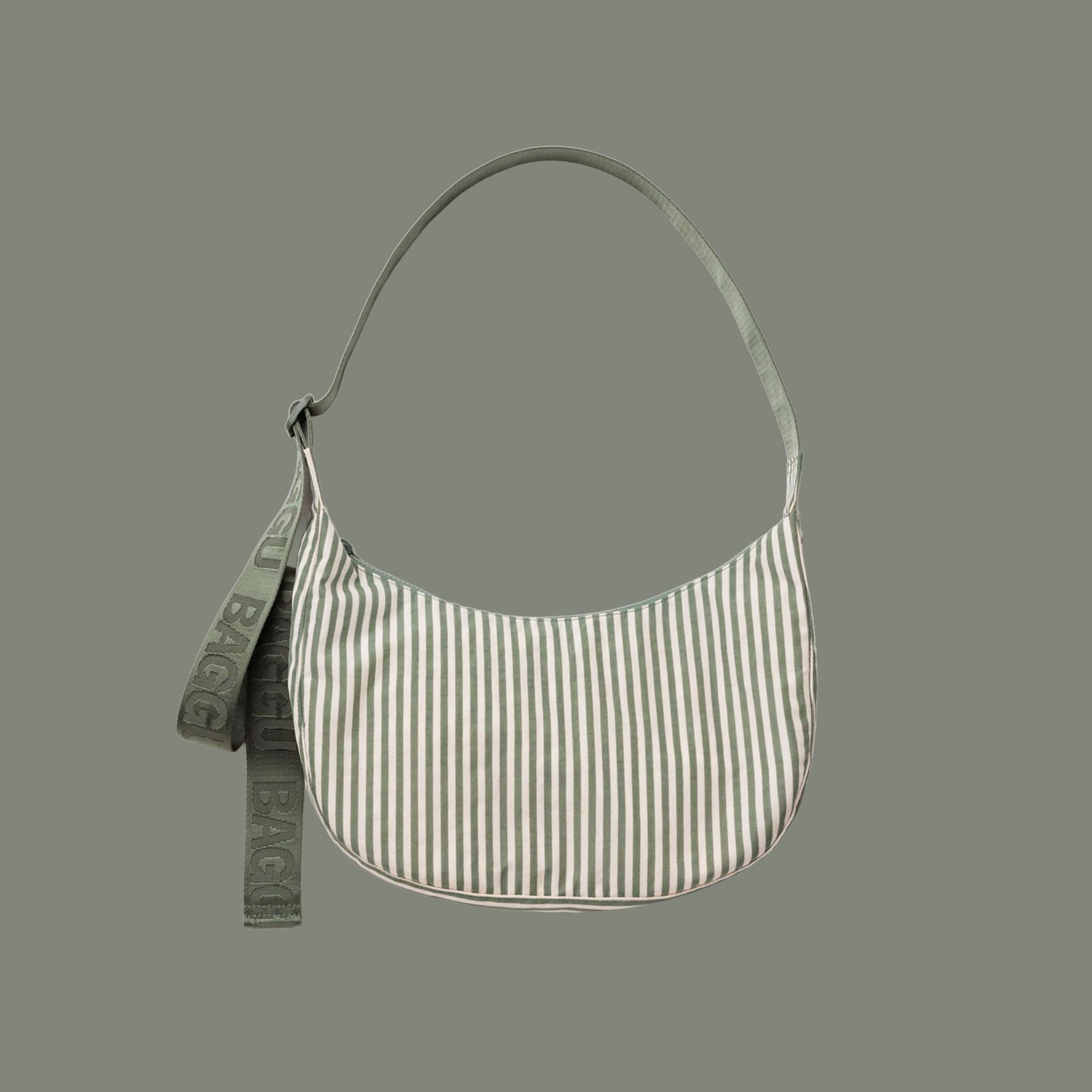 sage colored striped bag with sage colored straps on a sage colored ground.