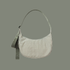sage colored striped bag with sage colored straps on a sage colored ground.