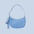 A blue crossbody nylon bag on a blue background.