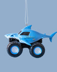 A blue Megalodon monster truck shaped ornament.