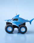 A blue Megalodon monster truck shaped ornament.