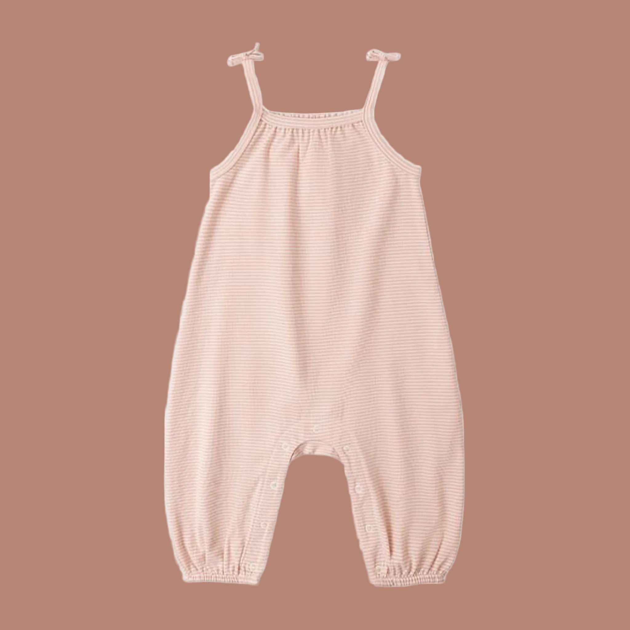 A cream and apricot colored jumpsuit. 